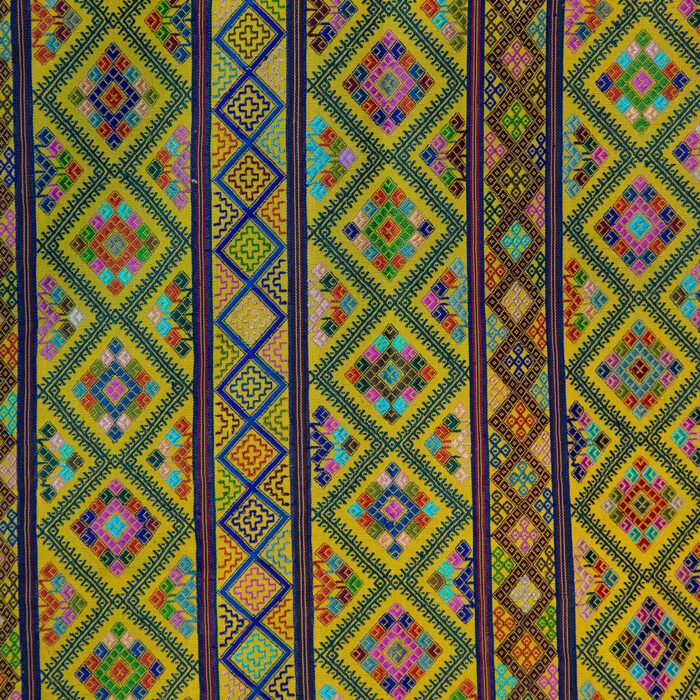 closeup of Large Colorful Yellow Textile with multicolor geometric designs