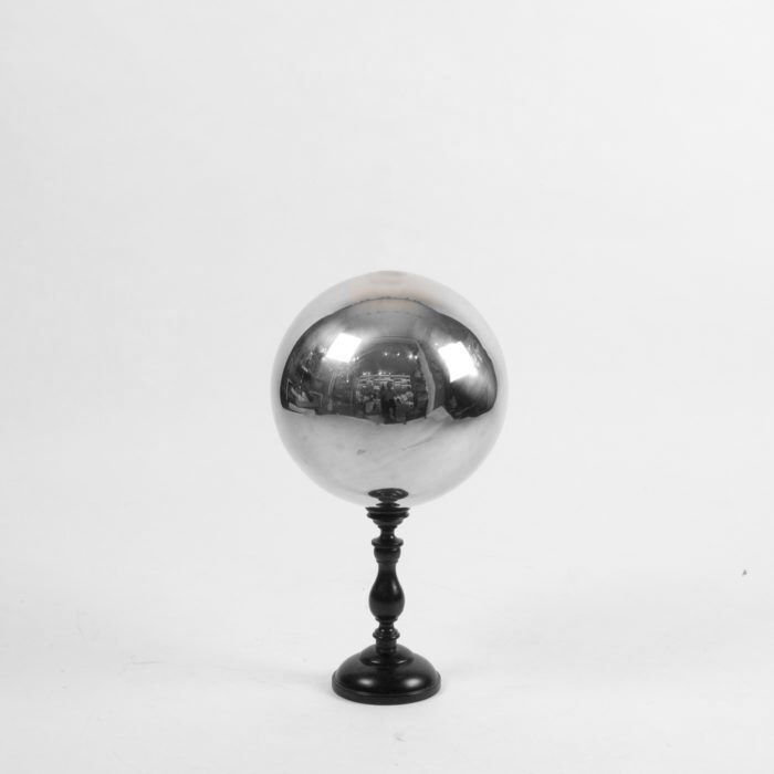 Butler's ball mounted on a turned wooden base