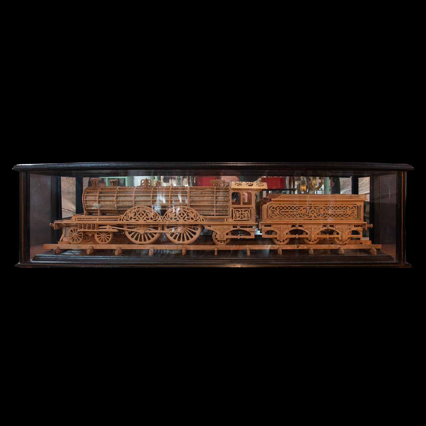 Carved Wood Model of a Locomotive in Black Lacquered and Glass Case