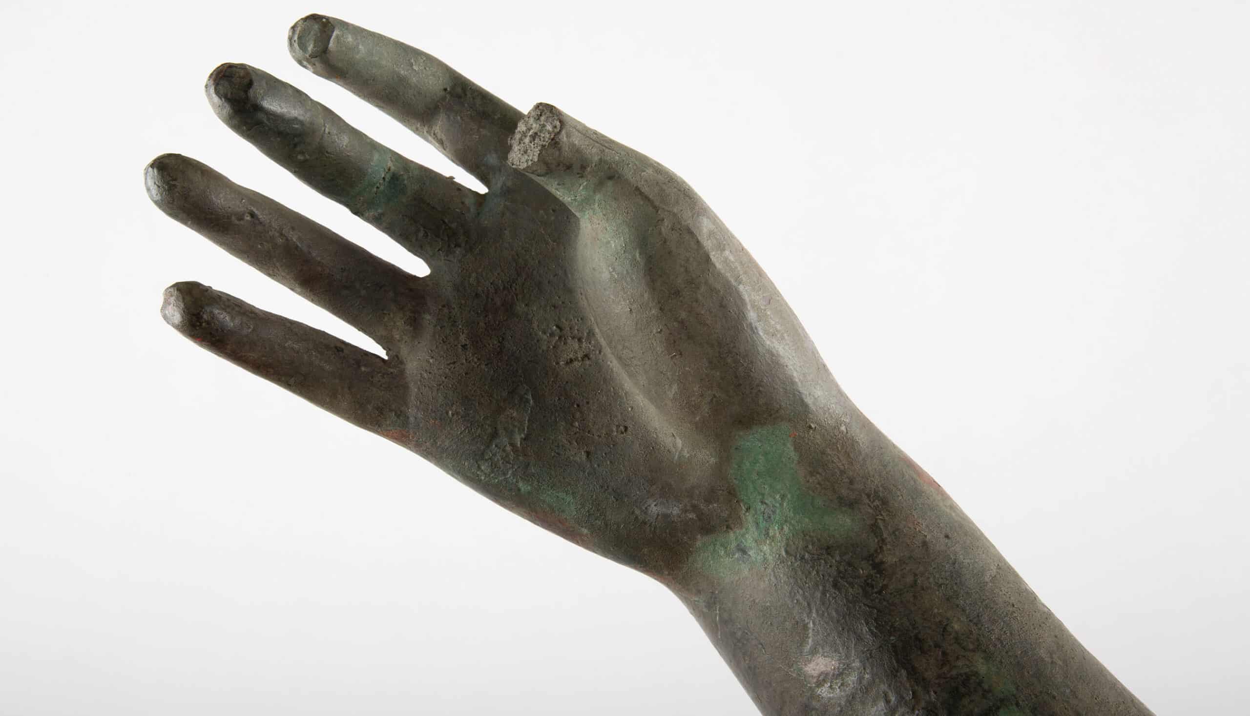Fragment of a Bronze Arm: Mounted Green-Patinated Bronze Sculpture