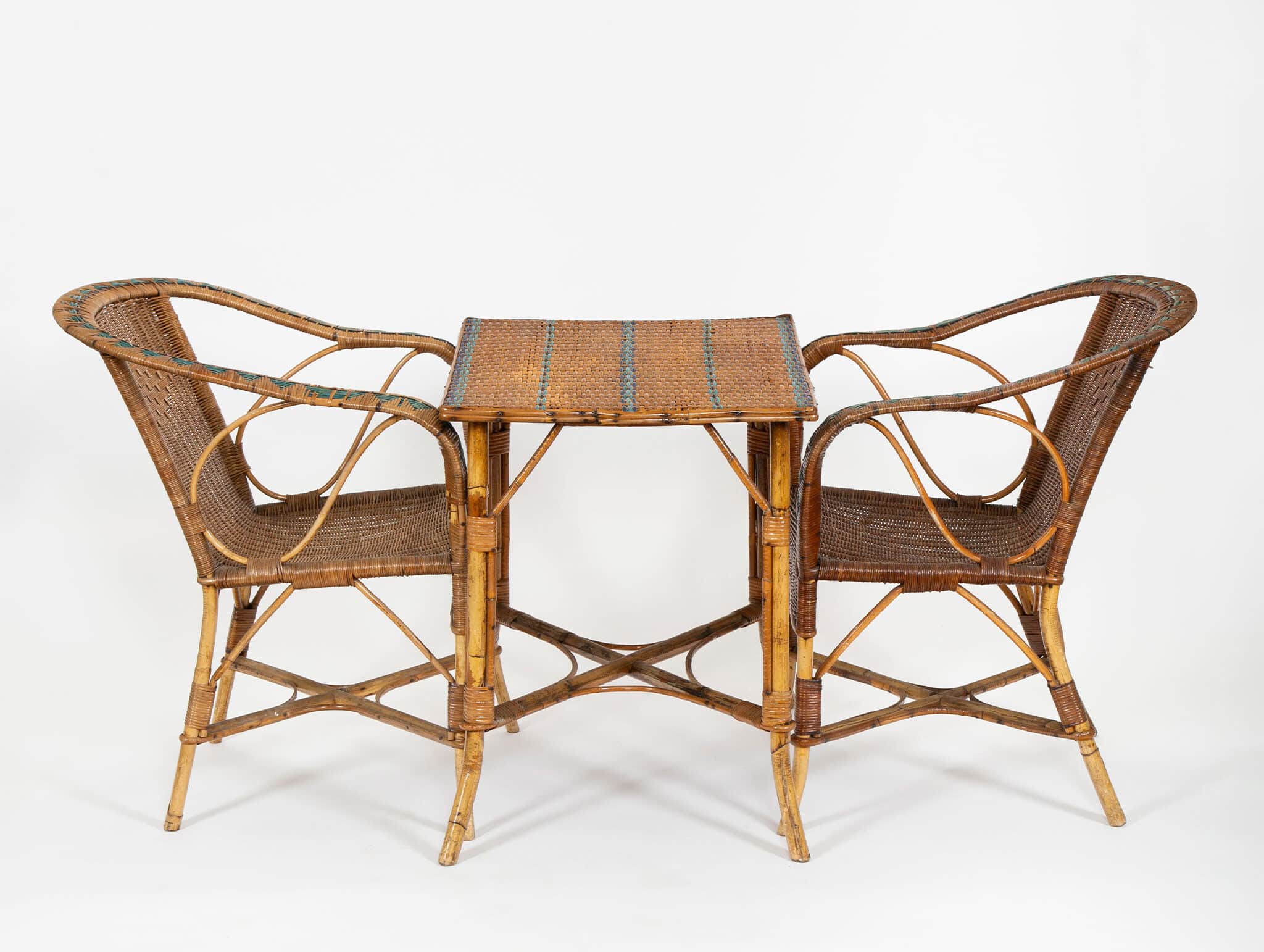 A Garden Salon in Rattan: Mid-Century French Rattan Armchairs with Side Table